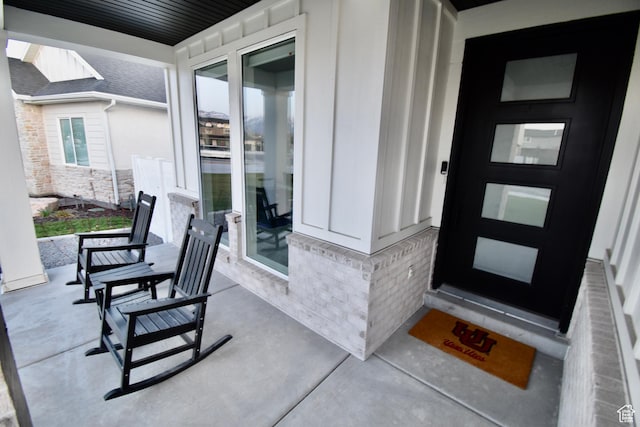 doorway to property featuring covered porch