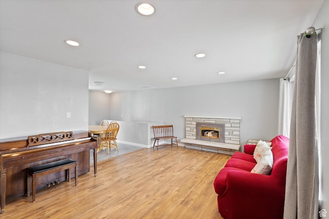 1322 N Main St, Centerville, UT 84014 - sitting room featuring recessed lighting, light wood-style floors, a stone fireplace, and baseboards