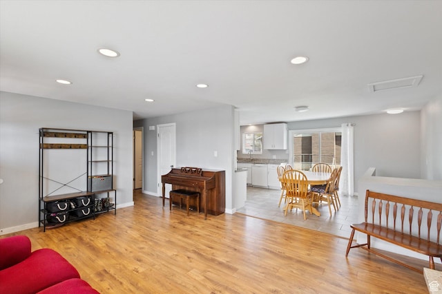 1322 N Main St, Centerville, UT 84014 - living room featuring recessed lighting, light wood-style flooring, baseboards, and attic access