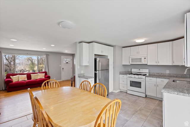 1322 N Main St, Centerville, UT 84014 - dining room featuring light tile patterned floors, baseboards, and recessed lighting