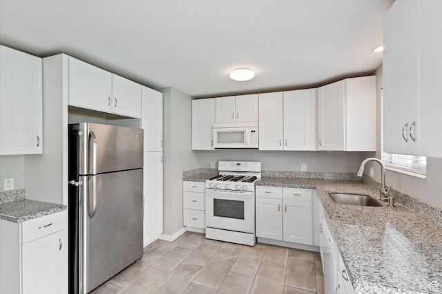 1322 N Main St, Centerville, UT 84014 - kitchen featuring white cabinets, light stone countertops, white appliances, and a sink