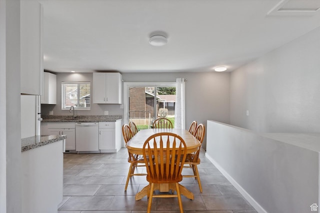 1322 N Main St, Centerville, UT 84014 - dining area featuring a healthy amount of sunlight, light tile patterned flooring, and baseboards