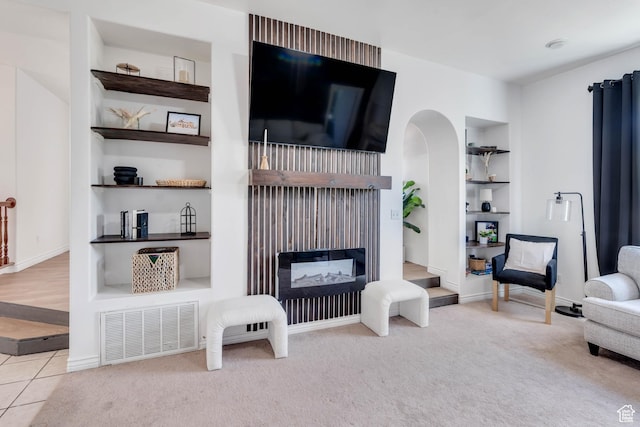 105 W 600 S, Manti, UT 84642 - living room with visible vents, built in features, baseboards, arched walkways, and carpet flooring