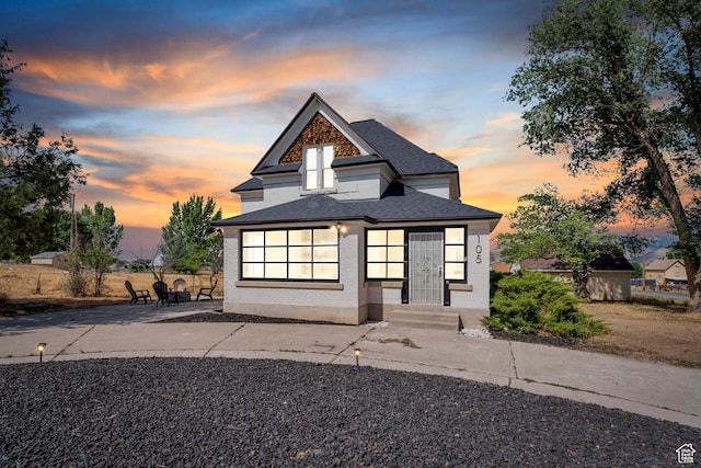 105 W 600 S, Manti, UT 84642 - view of front facade with brick siding, a patio area, and roof with shingles