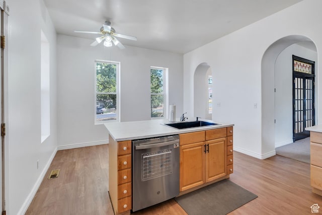105 W 600 S, Manti, UT 84642 - kitchen with visible vents, arched walkways, dishwasher, a sink, and light countertops