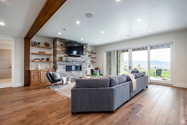 1285 N Oquirrh Mountain Dr, Heber City, UT 84032 - living area with recessed lighting, light wood-style flooring, a stone fireplace, and baseboards