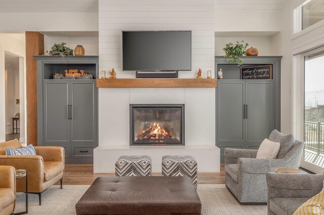 1285 N Oquirrh Mountain Dr, Heber City, UT 84032 - living area with a large fireplace and wood finished floors
