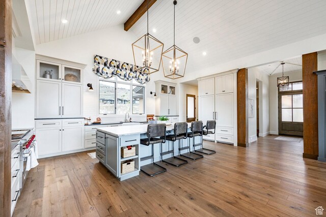 1285 N Oquirrh Mountain Dr, Heber City, UT 84032 - kitchen with a center island, a notable chandelier, a kitchen bar, and plenty of natural light