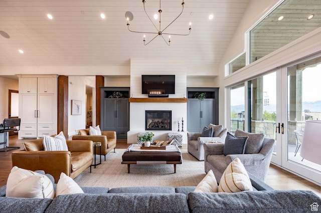 1285 N Oquirrh Mountain Dr, Heber City, UT 84032 - living room with wood ceiling, a glass covered fireplace, recessed lighting, wood finished floors, and a notable chandelier
