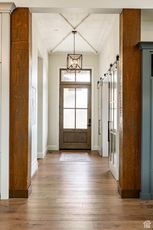 1285 N Oquirrh Mountain Dr, Heber City, UT 84032 - entryway with a barn door, hardwood / wood-style floors, and baseboards