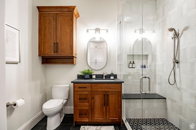 1285 N Oquirrh Mountain Dr, Heber City, UT 84032 - bathroom featuring tile patterned flooring, a shower stall, toilet, vanity, and baseboards