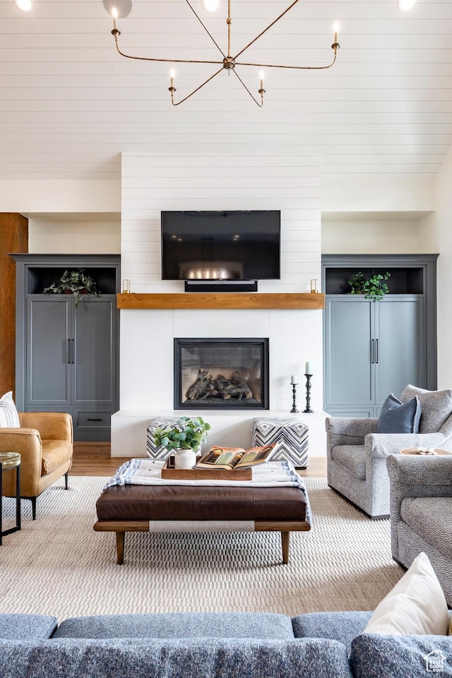 1285 N Oquirrh Mountain Dr, Heber City, UT 84032 - living room with a chandelier, wood finished floors, and a fireplace