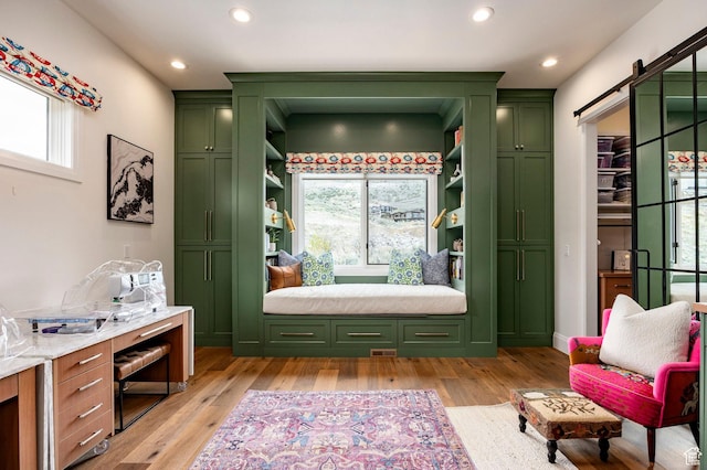1285 N Oquirrh Mountain Dr, Heber City, UT 84032 - mudroom with a barn door, light wood finished floors, and recessed lighting