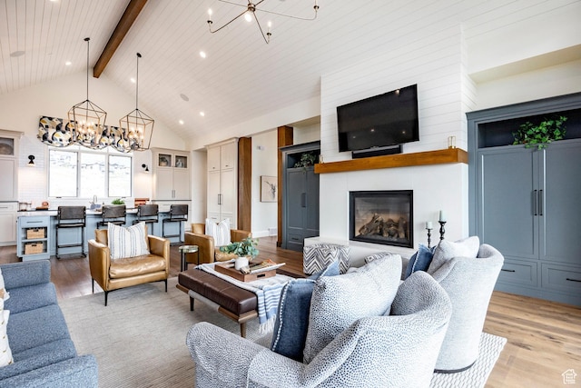 1285 N Oquirrh Mountain Dr, Heber City, UT 84032 - living area with beamed ceiling, a chandelier, a fireplace, high vaulted ceiling, and light wood-style flooring