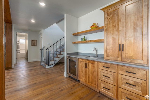 1285 N Oquirrh Mountain Dr, Heber City, UT 84032 - bar with a sink, beverage cooler, stairway, wood finished floors, and wet bar