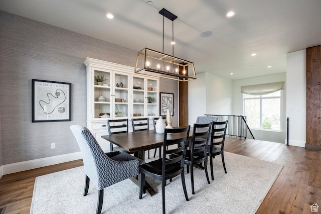 1285 N Oquirrh Mountain Dr, Heber City, UT 84032 - dining area with recessed lighting, a notable chandelier, baseboards, wallpapered walls, and wood finished floors