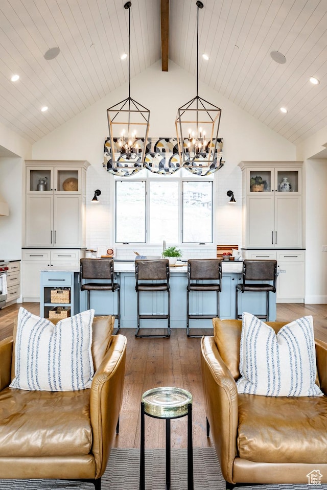 1285 N Oquirrh Mountain Dr, Heber City, UT 84032 - living area featuring hardwood / wood-style floors, lofted ceiling with beams, and an inviting chandelier
