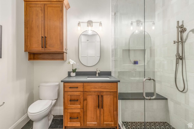 1285 N Oquirrh Mountain Dr, Heber City, UT 84032 - bathroom with toilet, vanity, a shower stall, and baseboards