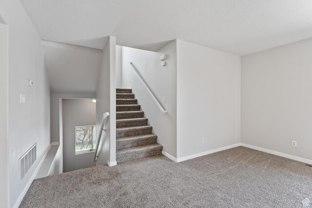 3794 W Morgan Blvd, Cedar Hills, UT 84062 - staircase featuring carpet, visible vents, baseboards, and a textured ceiling