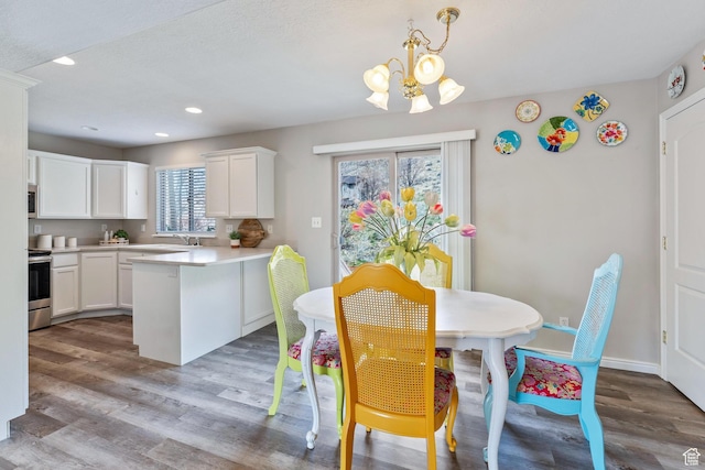 3794 W Morgan Blvd, Cedar Hills, UT 84062 - dining space featuring a chandelier, recessed lighting, baseboards, and wood finished floors