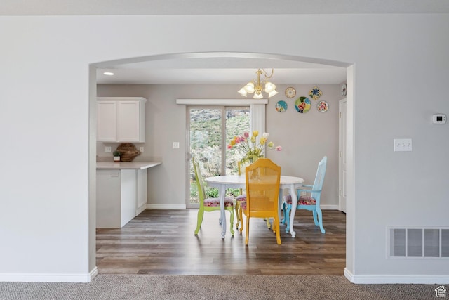 3794 W Morgan Blvd, Cedar Hills, UT 84062 - carpeted dining space with visible vents, baseboards, arched walkways, and a notable chandelier