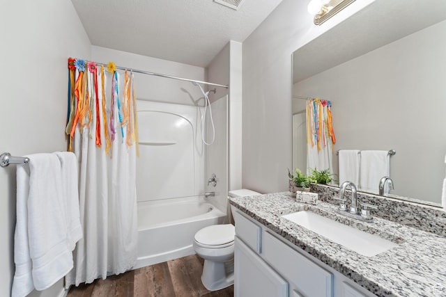 3794 W Morgan Blvd, Cedar Hills, UT 84062 - full bathroom featuring vanity, shower / bath combo, a textured ceiling, toilet, and wood finished floors