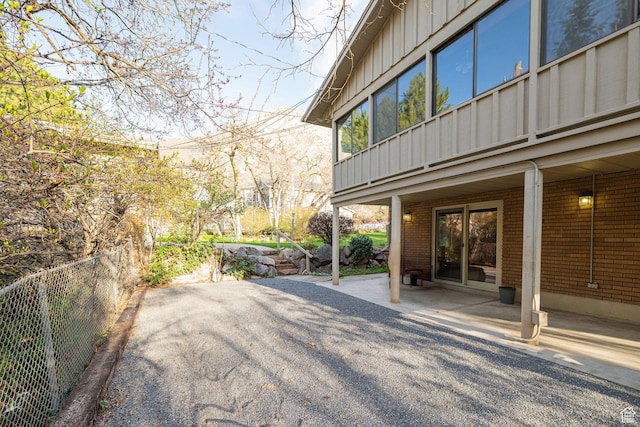 view of patio featuring fence