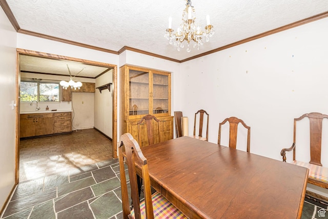 dining space featuring baseboards, a notable chandelier, a textured ceiling, crown molding, and stone finish flooring