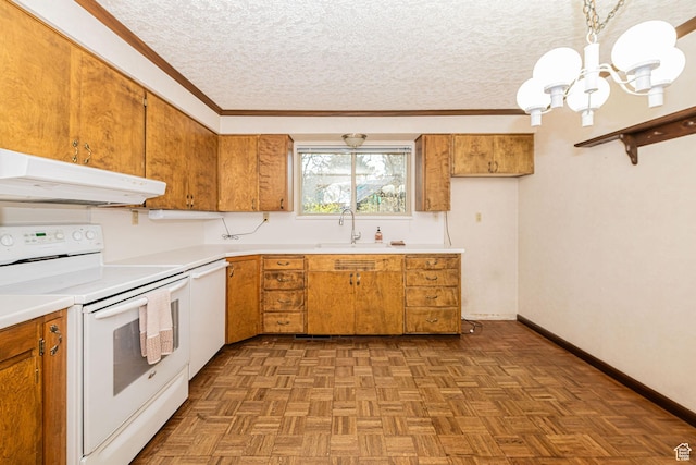 kitchen featuring a sink, white appliances, a chandelier, under cabinet range hood, and brown cabinetry
