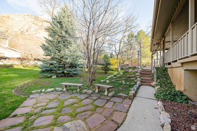 view of yard with stairs and a patio