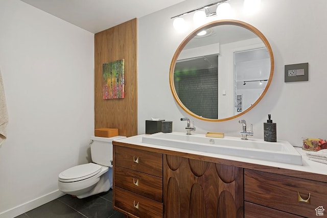 515 S 1000 E Unit 504, Salt Lake City, UT 84102 - full bathroom featuring toilet, double vanity, a sink, and tile patterned flooring