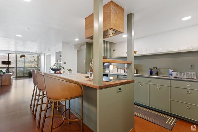 515 S 1000 E Unit 504, Salt Lake City, UT 84102 - kitchen with a kitchen breakfast bar, recessed lighting, open floor plan, butcher block counters, and floor to ceiling windows