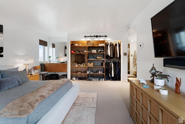 515 S 1000 E Unit 504, Salt Lake City, UT 84102 - carpeted bedroom with a closet, a spacious closet, visible vents, and connected bathroom