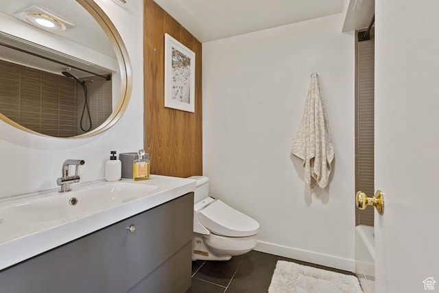 515 S 1000 E Unit 504, Salt Lake City, UT 84102 - full bathroom with toilet, vanity, baseboards, and tile patterned flooring