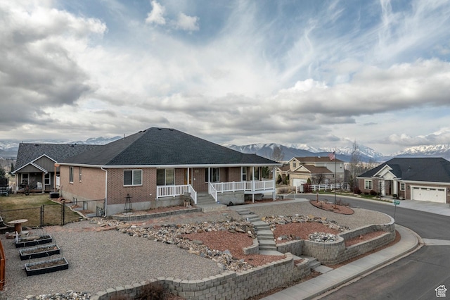 390 Ridge Dr, Heber City, UT 84032 - view of front of home with a residential view, roof with shingles, brick siding, fence, and covered porch