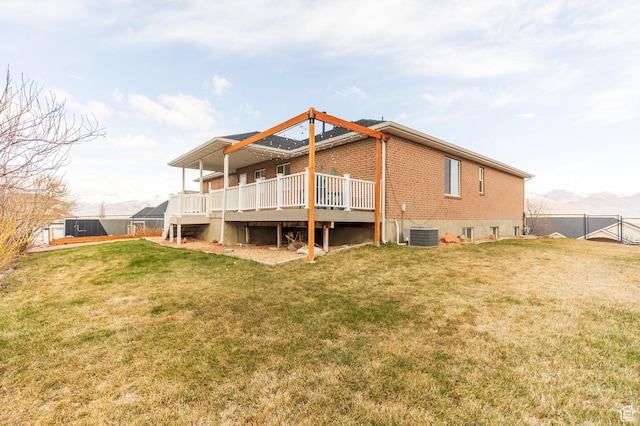 390 Ridge Dr, Heber City, UT 84032 - rear view of house featuring brick siding, a yard, a deck, and fence