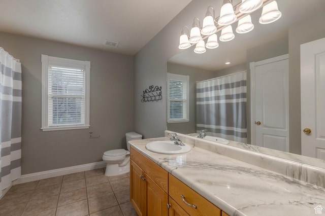 390 Ridge Dr, Heber City, UT 84032 - full bath featuring baseboards, double vanity, tile patterned flooring, toilet, and a sink
