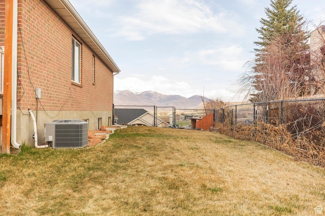 390 Ridge Dr, Heber City, UT 84032 - view of yard with a mountain view, central air condition unit, fence, and a gate