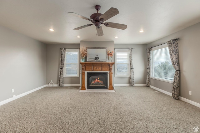 390 Ridge Dr, Heber City, UT 84032 - unfurnished living room featuring a fireplace with flush hearth, light colored carpet, baseboards, and recessed lighting