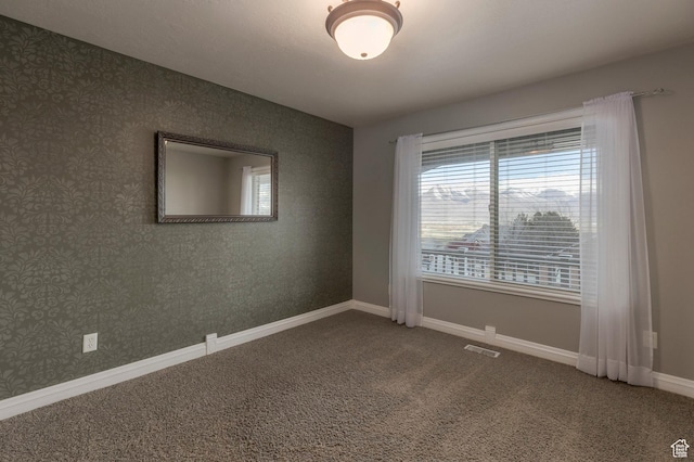 390 Ridge Dr, Heber City, UT 84032 - carpeted spare room with wallpapered walls, baseboards, and visible vents