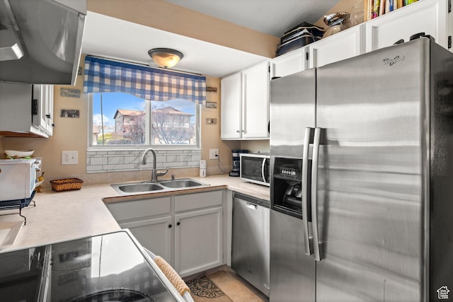 1155 W 2450 N, Layton, UT 84041 - kitchen with range hood, a sink, light countertops, appliances with stainless steel finishes, and white cabinetry