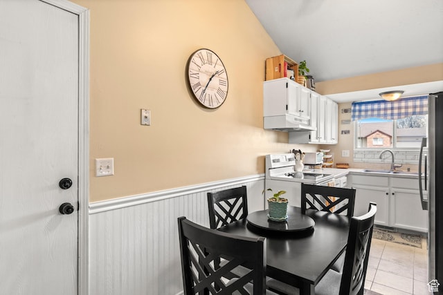 1155 W 2450 N, Layton, UT 84041 - dining space featuring a wainscoted wall and light tile patterned flooring