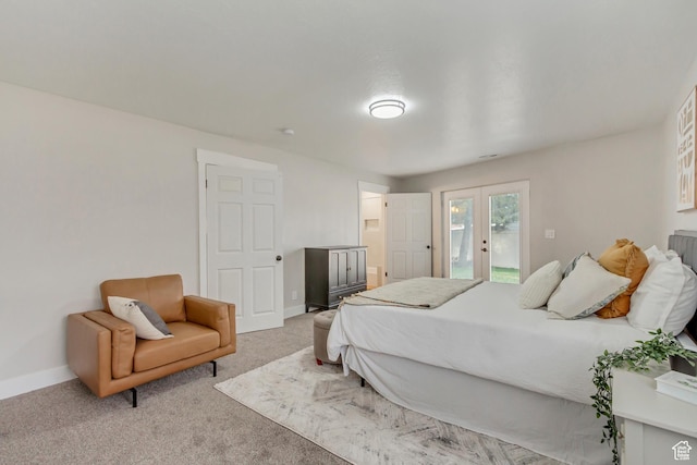 bedroom featuring french doors, access to exterior, carpet, and baseboards