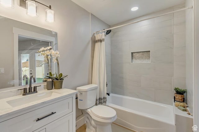full bathroom with toilet, shower / bathtub combination with curtain, and vanity