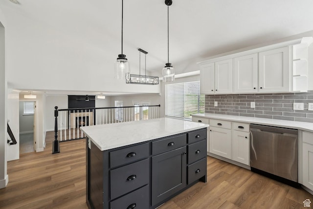 kitchen featuring open shelves, wood finished floors, dishwasher, and white cabinetry