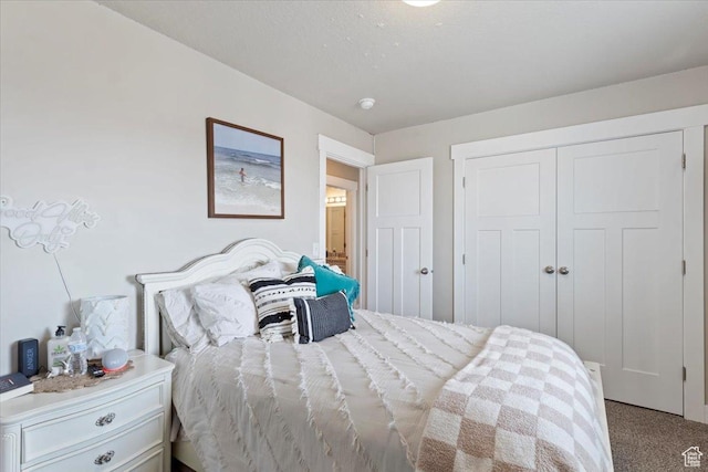 carpeted bedroom featuring a closet