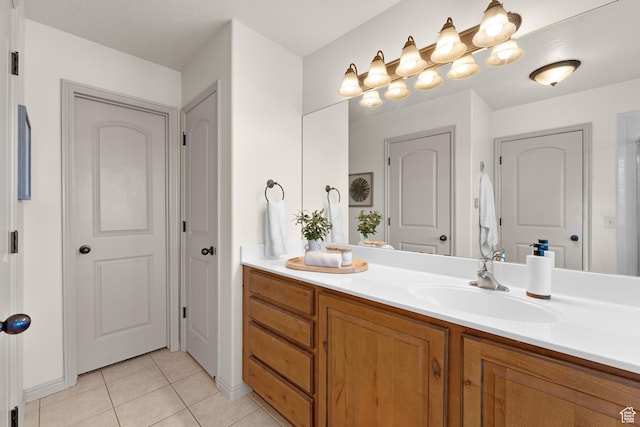 bathroom featuring tile patterned floors and vanity