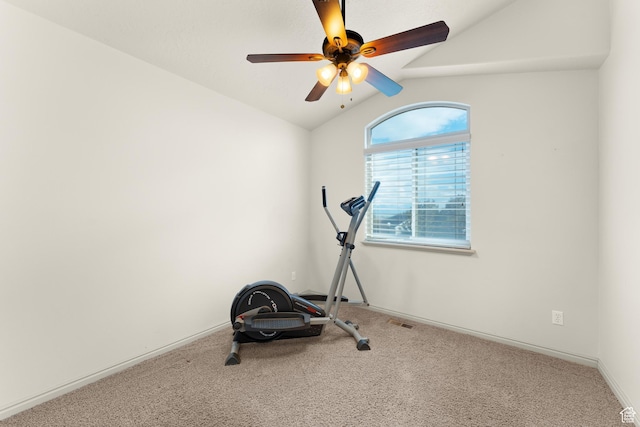 workout room with visible vents, carpet flooring, ceiling fan, and vaulted ceiling