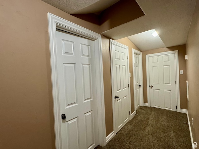 781 N Sherwood Dr, Layton, UT 84041 - corridor with baseboards, vaulted ceiling, a textured ceiling, and dark carpet
