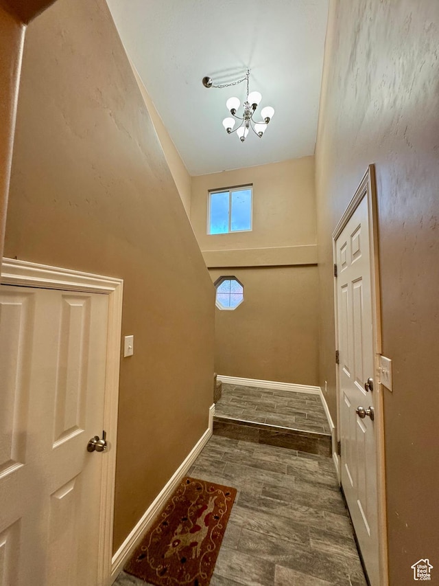 781 N Sherwood Dr, Layton, UT 84041 - doorway with baseboards, a chandelier, and wood finished floors